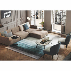 L-shaped sofa with a table and two chairs